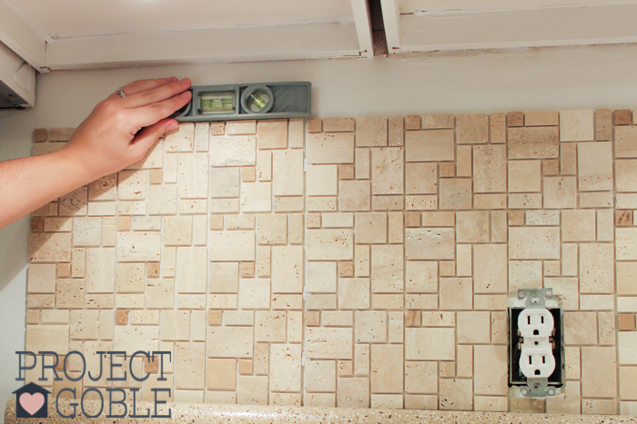 Got to make sure the Peel and Stick Instant Mosaic Tile Backsplash we used for our Kitchen is level!