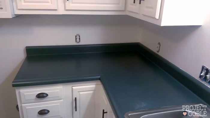 How to paint kitchen countertops to looks like granite! It's affordable and EASY! Also, how to paint Kitchen Cabinets White! www.ProjectGoble.com